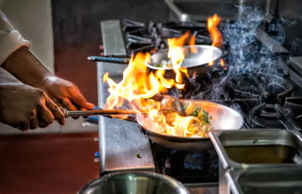 Photo of Flambe flame food frying pan