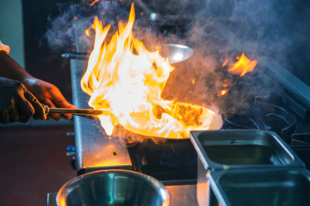 istock Flambe flame food frying pan 1180142183