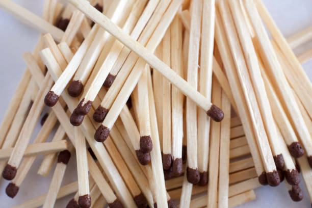 istock Matches on a white background scattered with a pack. To ignite a fireplace 1180142948