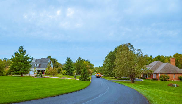 istock Midwestern suburb with school bus 1180144111