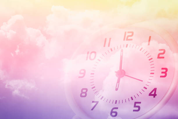 istock double exposure of cloudy sky and clock at six o'clock , time passing concept 1180146348