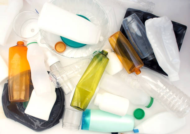 istock Recycling plastic background. separation concept. Plastic bottles and containers ready for recycling. Pile of multicolored plastic packaging background. close up. utilization. 1180148533