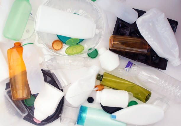 istock Recycling plastic background. separation concept. Plastic bottles and containers ready for recycling. Pile of multicolored plastic packaging background. close up. utilization. 1180148535