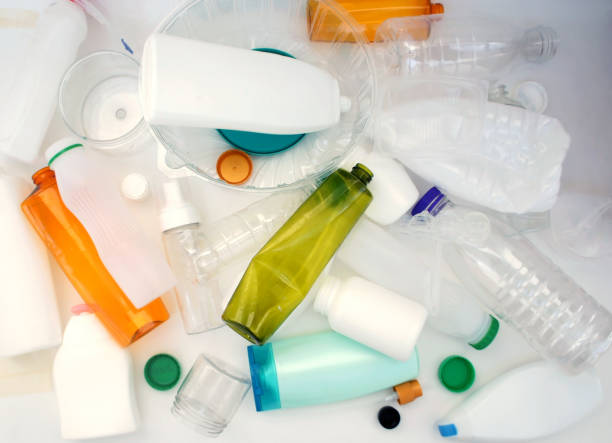 istock Plastic bottles for recycling. crumpled  plastic bottles and containers heap. close up. separation concept. top view. 1180148562