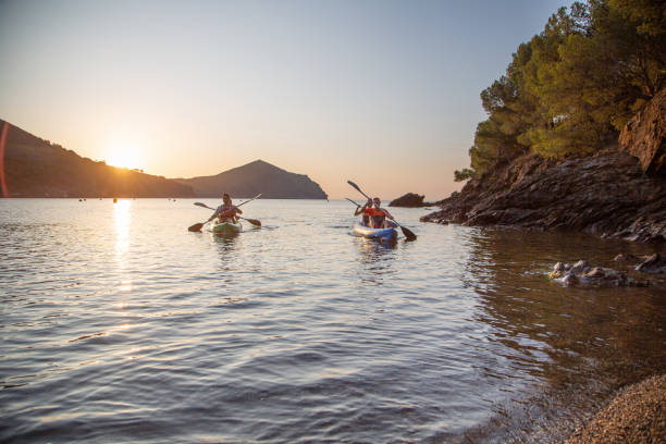 istock Friends Kayaking Along Shoreline at sunrise 1180151341