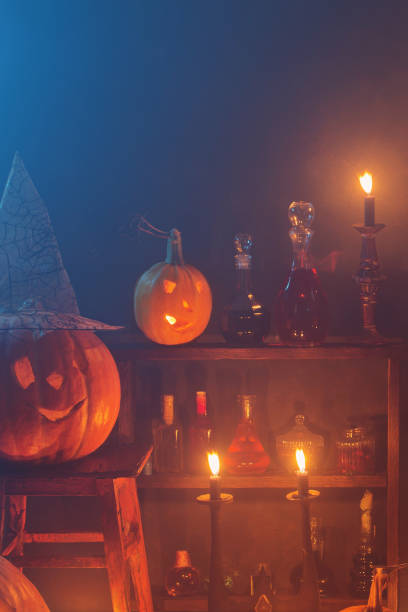 istock Halloween decoration with pumpkins and magic potions indoor 1180151385