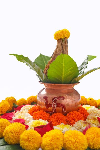 istock Copper Kalash with coconut ,  Red accounting note book, leaf and floral decoration on a white background. essential in hindu puja. 1180151522