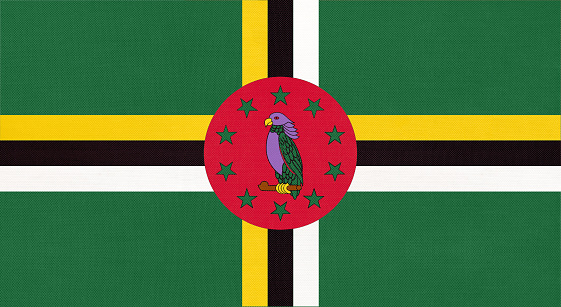 Dominica national fabric flag, textile background. Symbol of international world america country. State official dominican sign.