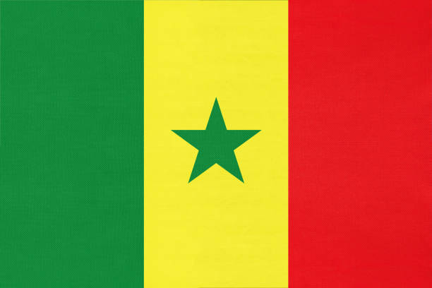 Senegal national fabric flag, textile background. Symbol of world african country. Senegal national fabric flag, textile background. Symbol of international world african country. State official senegalese sign. senegal flag stock pictures, royalty-free photos & images