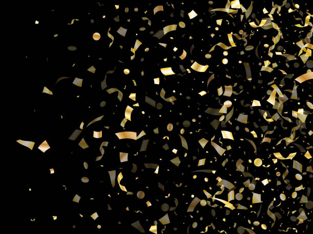 istock Holiday realistic gold confetti flying on black background. 1180155115