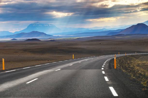 Picture of empty road with mountain Modrudalur and mountain Herdubreid as a background in Iceland, Summertime stock photo