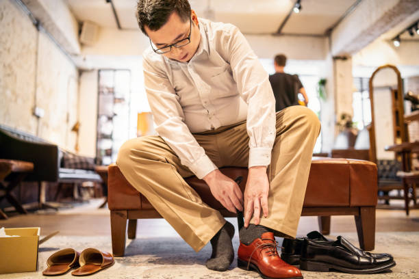 Customer trying on a new leather shoe