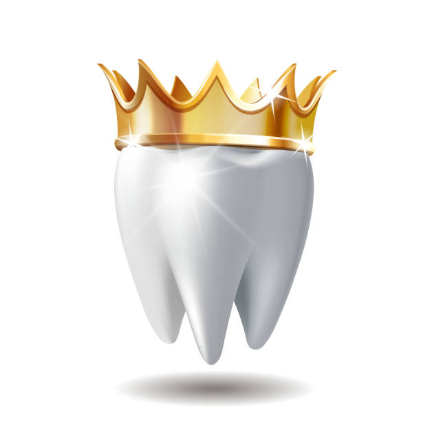 istock Realistic white Tooth in golden crown isolated on white 1180158450