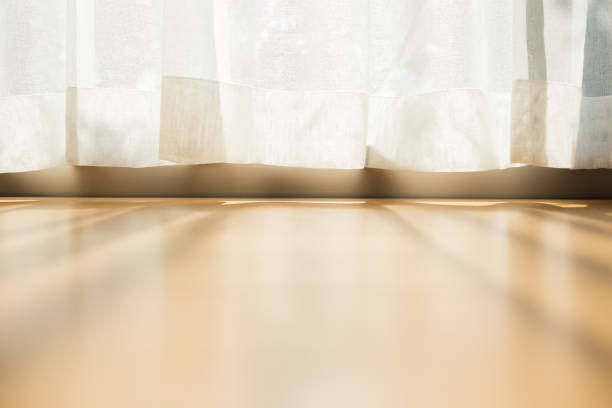 istock morning sunlight through curtain in room 1180161623