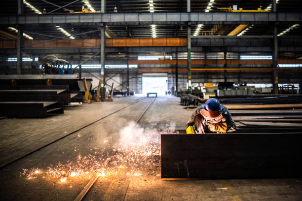 Welder working in a factory.
