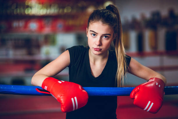 istock Pretty girl in a boxing ring 1180164277