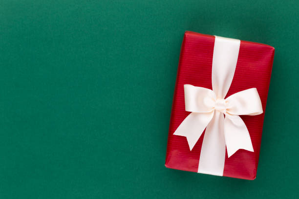 istock Christmas gift boxes with ribbons on color tabletop. 1180164445