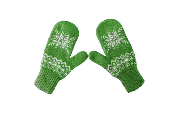 istock pair of green knitted mittens with christmas pattern isolated on 1180164741