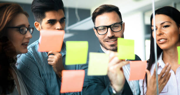 istock Group of business people collaborating in office 1180164803