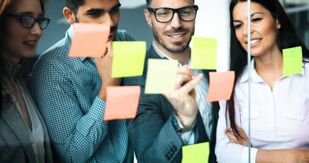 istock Collaboration and analysis by business people working in office 1180164813