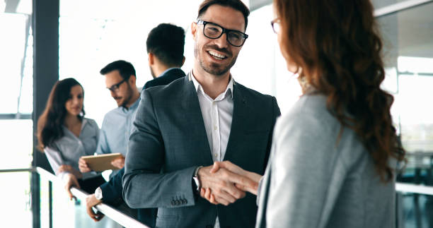 istock Corporate teamworking colleagues in modern office 1180165359