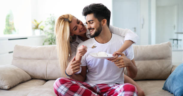 istock Cute young cheerful couple spending time at home 1180165635