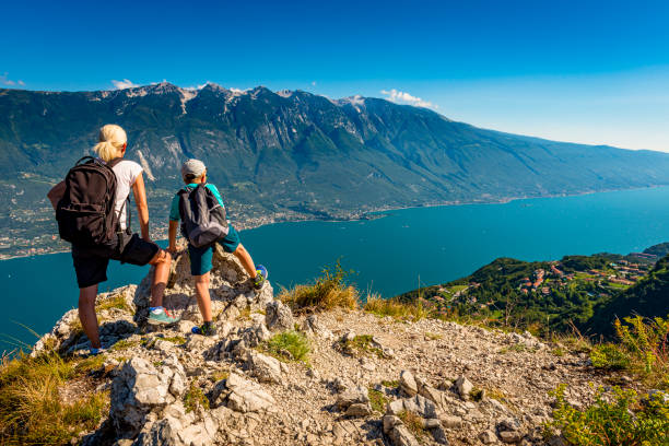 mother and son looking down to Lake Garda in Italy mother and son looking down to Lake Garda in Italy lake garda photos stock pictures, royalty-free photos & images