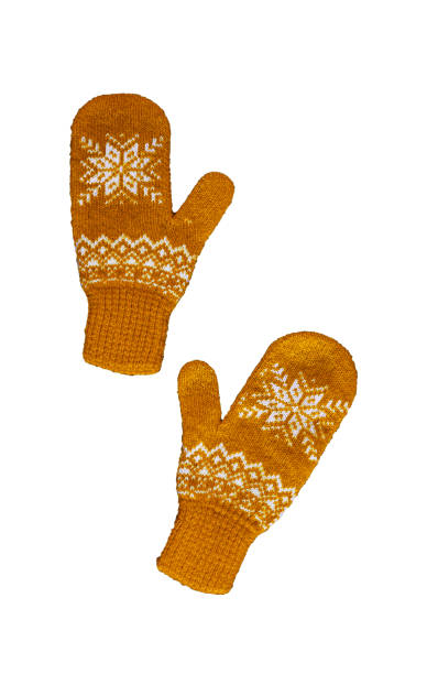 istock pair of yellow orangeknitted mittens with christmas pattern isolated on 1180165734