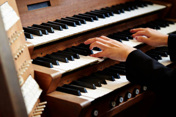 Playing the pipe organ stock photo