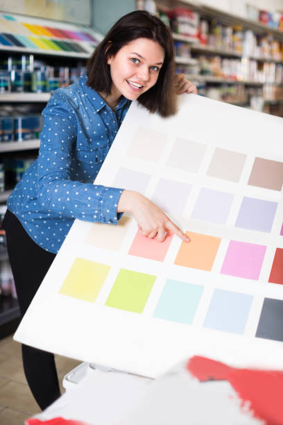 istock Young female is deciding on best color scheme 1180169430