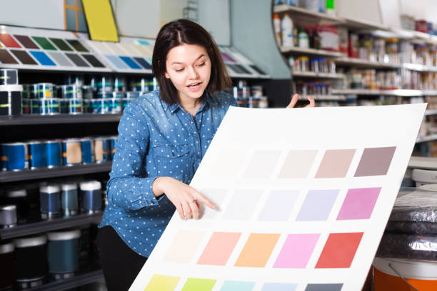 istock Girl is deciding on best color scheme 1180169443