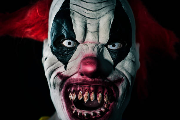 istock scary evil clown with a bloody mouth 1180170299