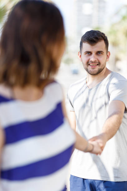 istock Happy man and girl standing and hugging 1180170419