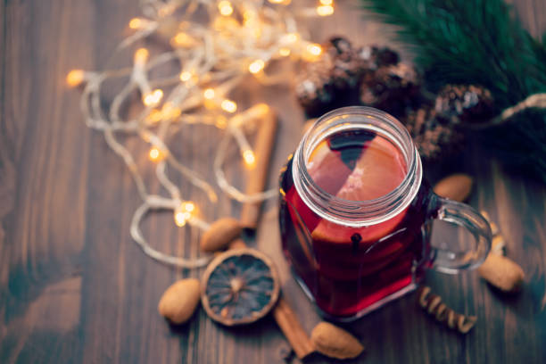 istock hot wine on brown wooden background 1180170677