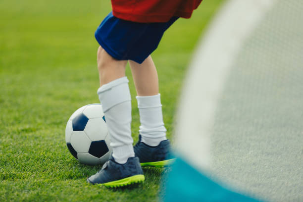 istock Young Soccer Player Training with Ball 1180170914