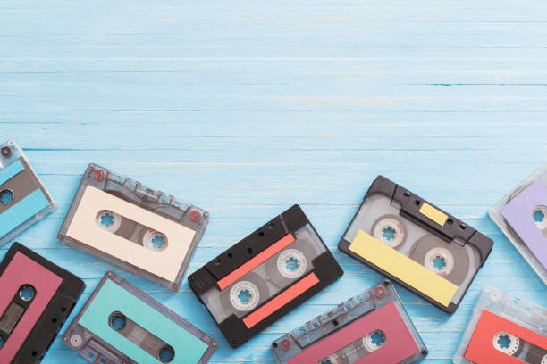 istock Old plastic cassette on wooden background. Retro music concept 1180171047