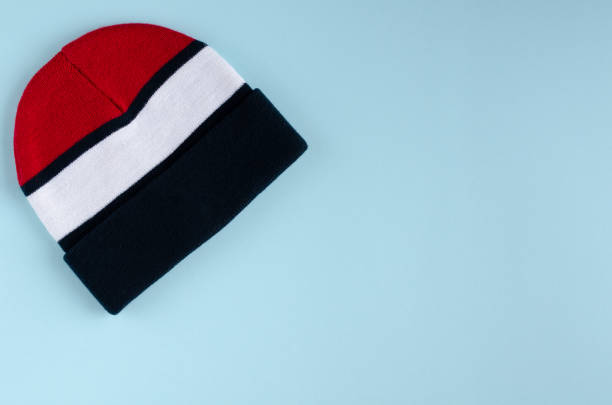 istock Striped colored hat composition on blue background. 1180172186