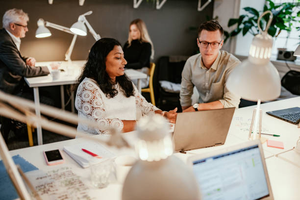 istock Diverse colleagues discussing new investment 1180172734