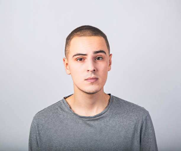 istock Skeptical serious man with grimacing face. Closeup studio portrait 1180173758