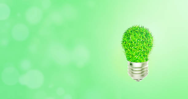 istock Green light bulb with bokeh light in background. 1180173942