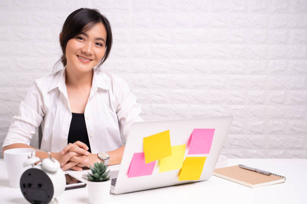 istock Happy woman sitting at home office working using computer laptop 1180173979