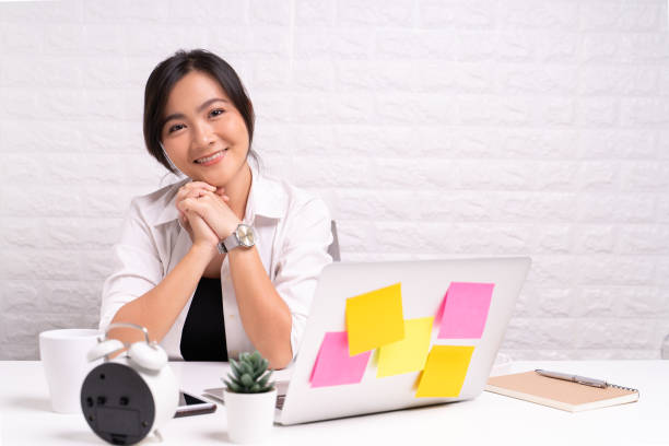 istock Happy woman sitting at home office working using computer laptop 1180174189