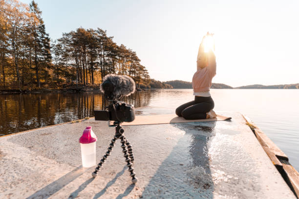 istock Woman recording a vlog while exercising 1180175804