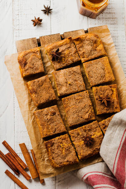 Spicy Pumpkin bars Blondie Squares with Cinnamon, Anise and Caramel. Traditional English Dessert. Top view. Spicy Pumpkin bars Blondie Squares with Cinnamon, Anise and Caramel. Traditional English Dessert. Top view. blondy stock pictures, royalty-free photos & images