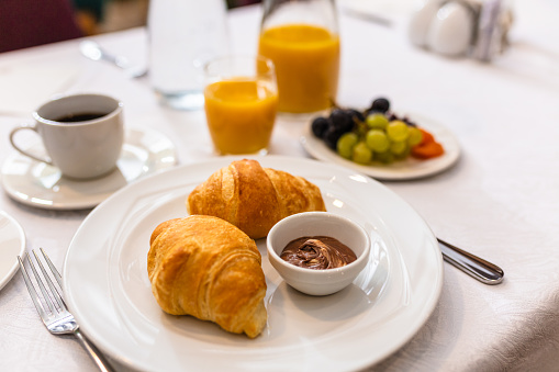 Breakfast with croissants and cup of coffee