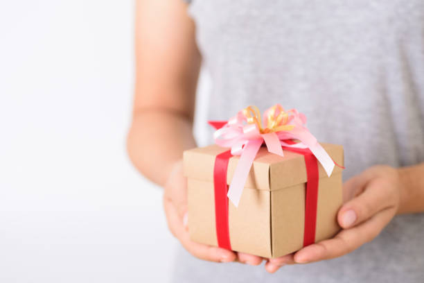 istock Gift box in hand for giving 1180177551