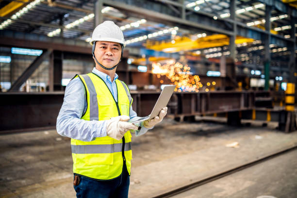 istock Confident Asian engineer in a factory 1180178640