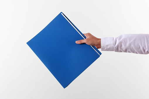 Businesswoman holding file folder