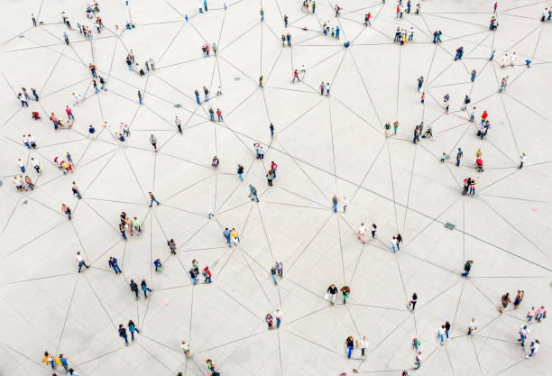 Aerial view of crowd connected by lines Aerial view of crowd connected by lines business stock pictures, royalty-free photos & images