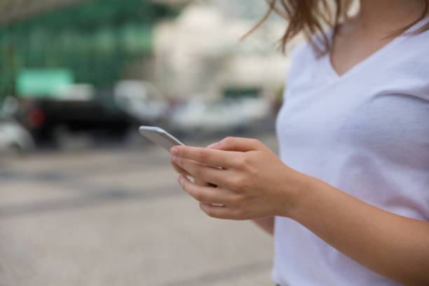 istock Closeup shot of female hands using smartphone 1180193209